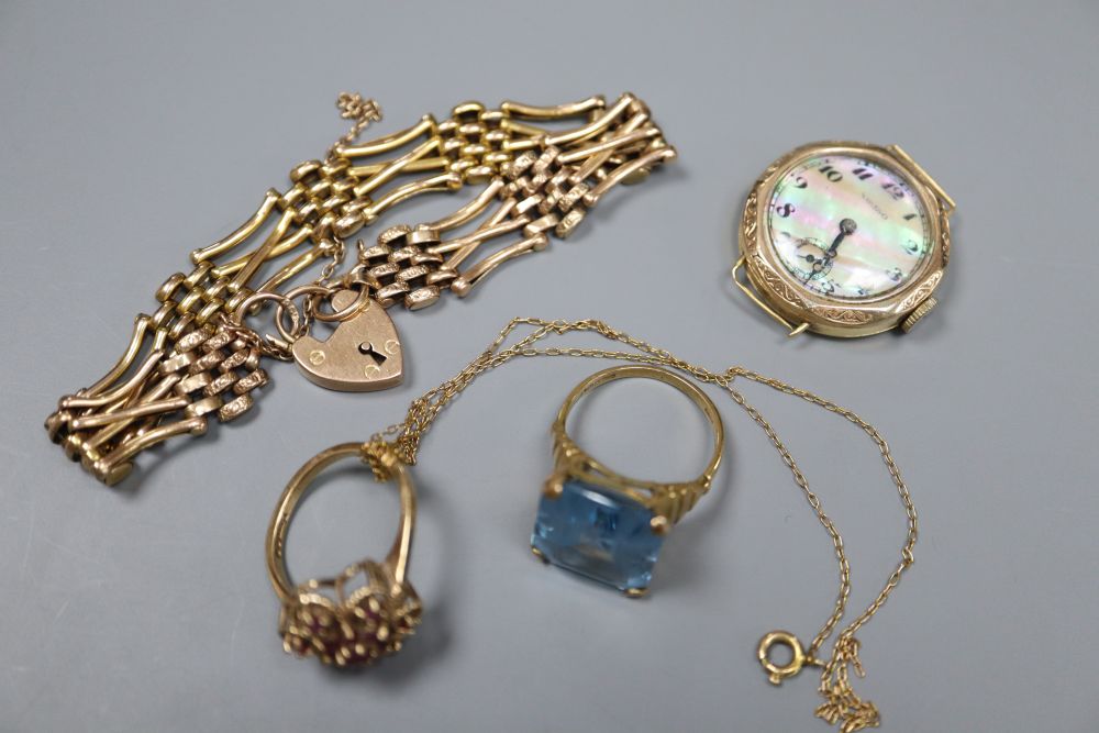 A 9ct gold gate-link bracelet, two 9ct and gem set rings, a 9ct fine chain and a ladys 18ct gold wrist watch.